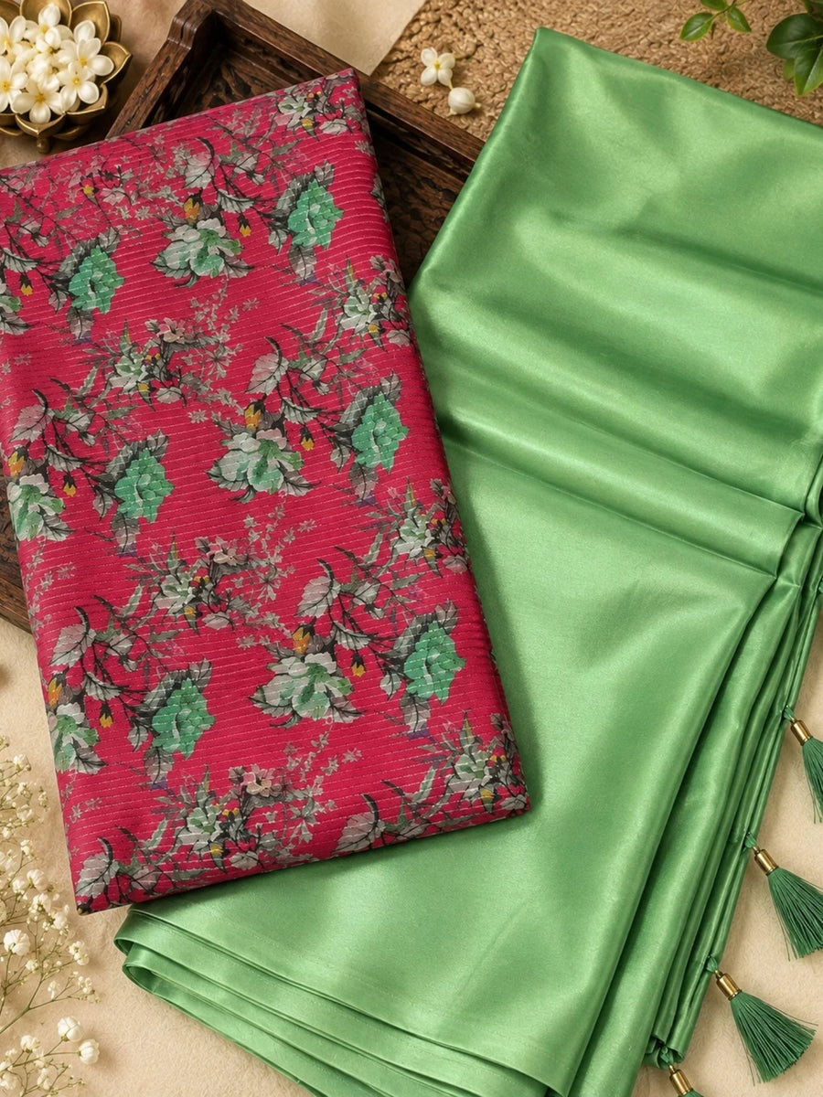 Light green saree with a floral blouse, draped on a woman outdoors with tassel detailing.
