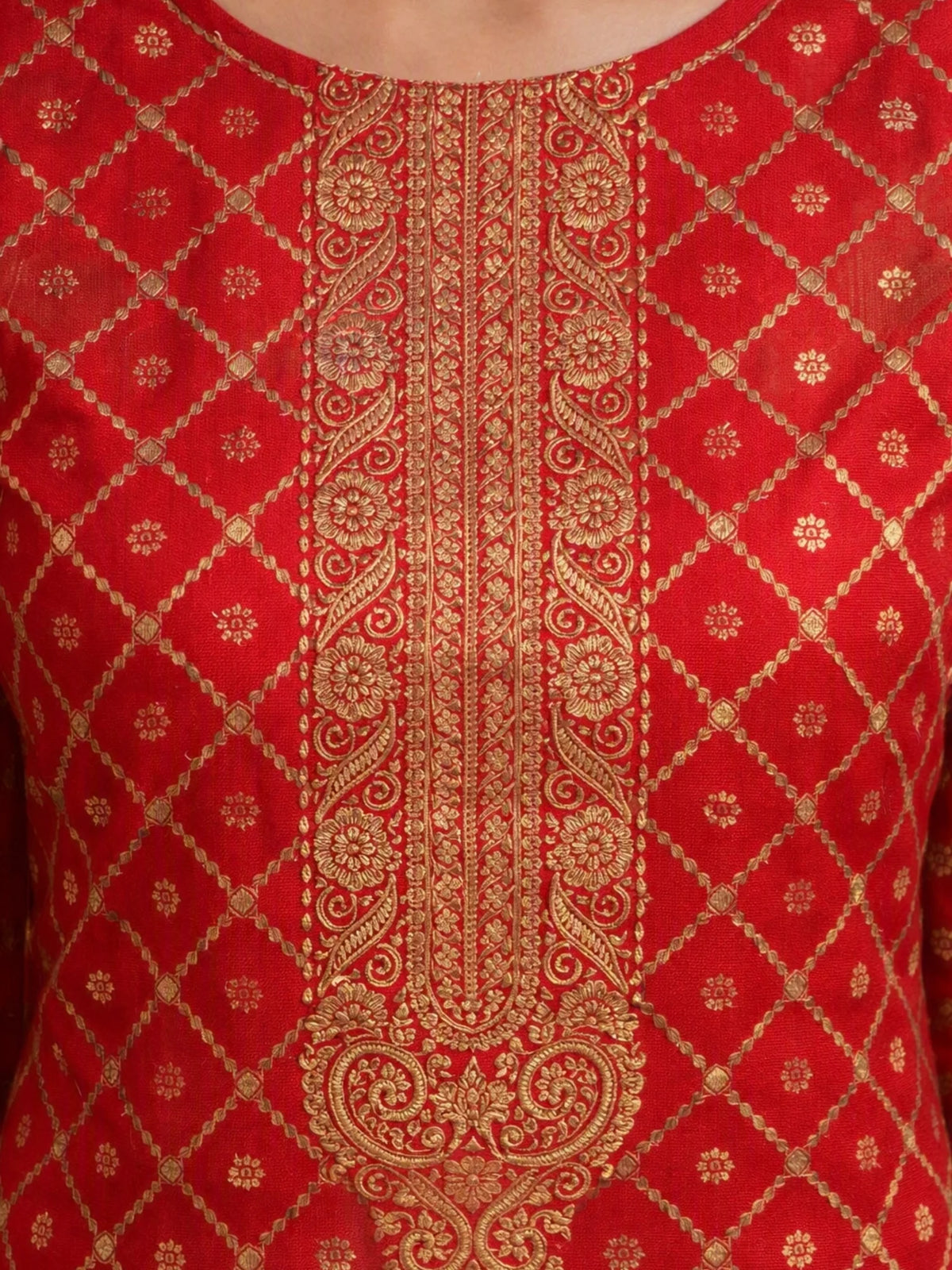 Woman wearing a red embroidered suit with matching pants and a multicolored printed dupatta.